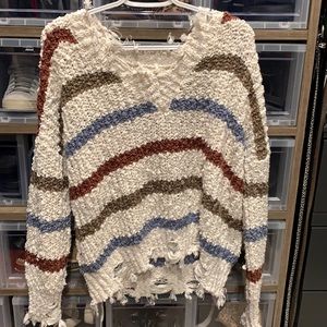 Distressed white striped V-neck sweater size large